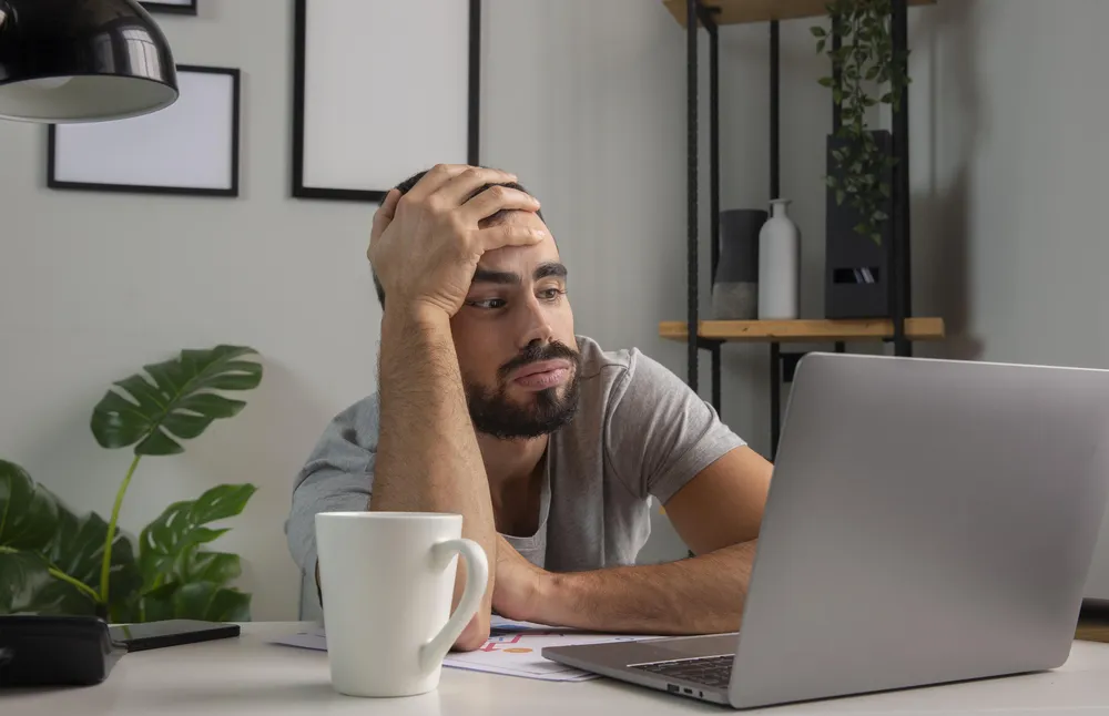 man-feeling-bored-while-working-from-home